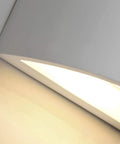 Close-up of Dope LED Wall Sconce Light 7W Warm White 2700K up and down plaster finish indoor wall lamp in use