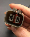 Close-up of two-pin connector from Mitsubishi Alternator Wiring Harness Repair Kit For Hitachi And Nissan Plugs Pigtail Connector
