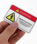 Hand holding PVC Mechanical Safety Warning Stickers Set 10pcs High Visibility Danger Decals For Machinery Equipment Prevent Accidents