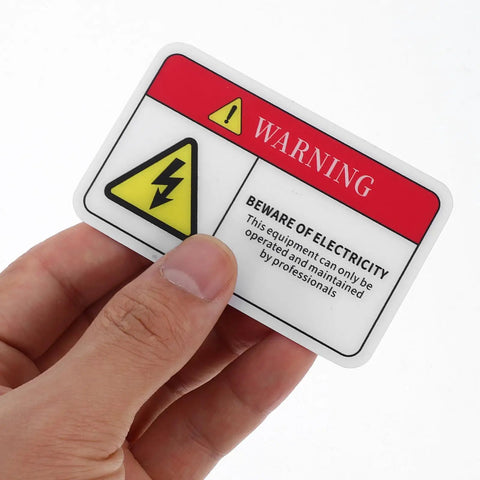 Hand holding PVC Mechanical Safety Warning Stickers Set 10pcs High Visibility Danger Decals For Machinery Equipment Prevent Accidents