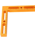 Orange metal square with ruler marks for Pro Grade CNC Workpiece Positioning Fixture Kit Vise Clamp With Side Clamping For T Slot Perforated Tables Built