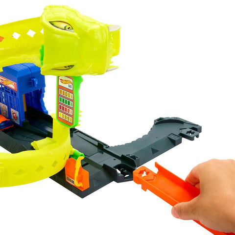 Snake Spiral Attack Toy Car Track Set with hand loading track piece into corkscrew loop.