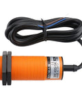 Capacitive Proximity Sensor Cylindrical M30 Plastic Sn 15 mm 220V NC Contacts 2 Wire Cable, shown with orange ribbed housing and black cable.