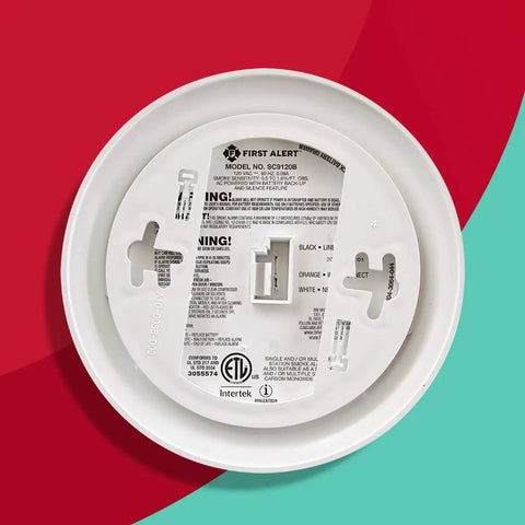 Hardwired Smoke And Carbon Monoxide Combo Detector With Adapter Plugs For No Sweat Swap Install And Ten Year Battery Backup back view with labeling.