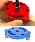 Heavy Duty Aluminum Wood Panel Hole Puncher With Ridiculously Precise Center Punching Gauge for layout, showing red and blue tools during use.
