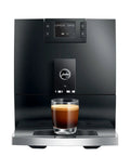 Top Shelf Automatic Coffee Machine In Sleek Piano Black Featuring Fresh Aroma Grinder PEP Brew Tech Dual Cup Options And Killer Crema presented with espresso in a glass.