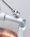 Close-up of Commander Wall Mount Service Sink Faucet With 8-Inch Centers, rough chrome finish showing spout and brass assembly detail.