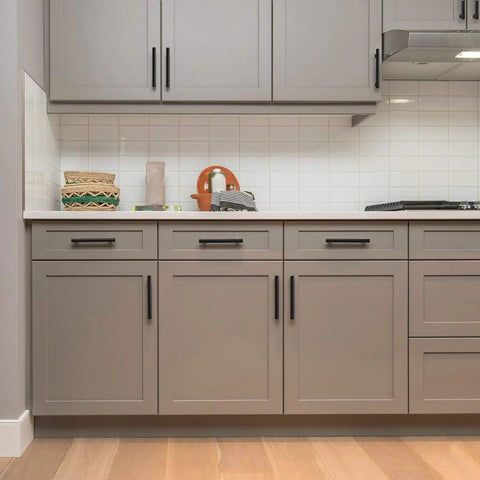 Six Pack 6 Inch Cabinet Pulls Sleek Matte Black Stainless Steel Kitchen Cupboard Handles Center To Center 3.75 Inch Spacing Durable Modern Hardware For Cabinets installed on grey cabinetry in a kitchen setting.