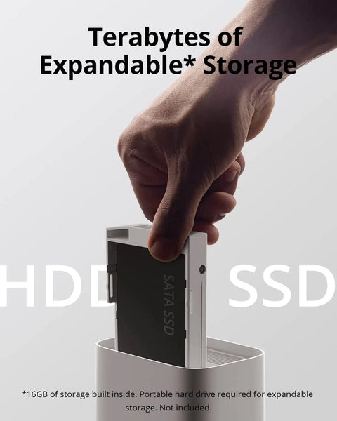 Hand inserting SATA SSD drive into Home Security Hub With 16TB Expandable Local Storage, Edge Security Center For Up To 50 Cameras.