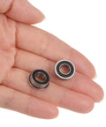 Hand holding Flanged Ball Bearing One Quarter By One Half By Three Sixteenths Inch Tough Double Sealed Chrome Steel FR188-2RS Rubber Sealed Flange Bearing Set Four Pieces