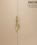 Chic Vintage Brass Flower Drawer Pulls Bring Rustic Charm to Kitchen Cupboards and Wardrobe Dressers Featuring Snazzy Twig Design cabinet handle on beige cabinet.