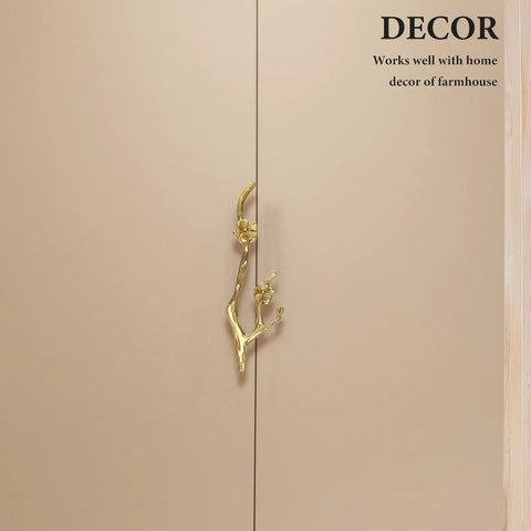 Chic Vintage Brass Flower Drawer Pulls Bring Rustic Charm to Kitchen Cupboards and Wardrobe Dressers Featuring Snazzy Twig Design cabinet handle on beige cabinet.