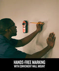 Person using 2-In-1 Laser Level And Stud Sensor Pro Grade Tool With Self Leveling Beam for precise wall marking.