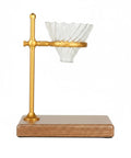 Premium Heavy Duty Copper Alloy Pour Over Coffee Dripper Stand With Weighted Stable Cone Filter Holder For Smooth Top Shelf Brewing Station Setup Game Changer on wooden base.