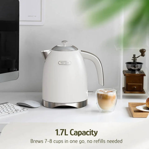 1.7L Electric Kettle With Stainless Steel Interior, BPA-Free, 1200W Fast Boil, Cordless With Rotational Base, Pearl White on desk