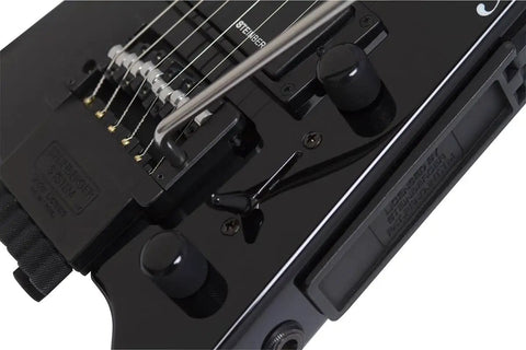 Spirit GT Pro Deluxe Black Electric Guitar With Gig Bag Maple Body Locking Tremolo R Trem System Humbucker Neck Pickup And Single Coil Middle Pickup Lightweight Built For Stage Ready Studio And Street Jams, close-up of black R-Trem bridge