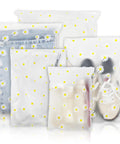 Stash And Pack Travel Storage Bags For Clothes And Gear Clear Reusable Ziplock Pouches Waterproof Resealable Luggage Organizer Set 5 Sizes 30 Pieces For Clothes Towels Shoes Cosmetics on display with floral pattern.