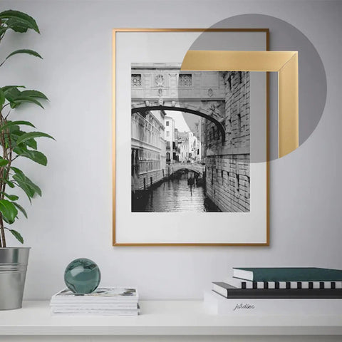 Matte Gold Peel And Stick Molding Trim, Flexible Mirror Border used on framed photo, showing 5m length, 0.66cm width.