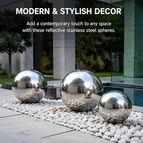 Three dope polished hollow stainless steel balls 201 grade, placed on pebbles for modern outdoor decor, 250mm diameter, 0.6mm wall thickness