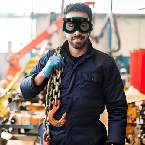 Top Shelf Welding Goggles Four Pack Anti Glare Safety Glasses With Comfy Adjustable Fit Rock Solid Build worn by worker holding chains.