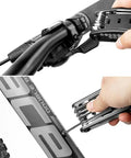 Using the 16 In 1 Bicycle Multitool Kit For On The Go Mountain Bike Maintenance on handlebars and frame, includes Hex Key Wrench Set.
