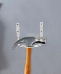 Heavy Duty Hammer Holder Wall Mount Tool Rack With Iron Hooks, 4 Pack displayed with hammer on gray wall