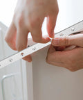 Flat Straight Furniture Brackets Set of 4 in Stainless Steel, 9.63 x 0.79 x 0.12 Inches being installed on furniture corner