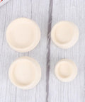 4pcs Rubber Bathtub Stopper Plug with Hanging Ring for Sink Drains in various sizes laying on a wooden surface.
