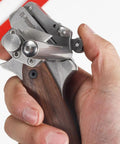 Close-up of a hand holding a Heavy Duty Leather Strap Cutter Made From Aluminum Alloy Adjustable Manual Belt Cutter Tool
