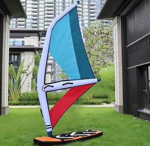 Inflatable Wing Foil 4.2 Square Meters Windsurfing Kite For Wind Wing Foiling And Water Play Stoked To Ride With Premium Oxford PVC Construction Waterproof Durable Easy Setup For Surfing Snow Ski Surfing And More, set up on green lawn, showcasing multi-colored sail and compact design.