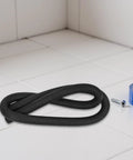Pro Level Black Foam Backer Rod For Rock Solid Gap Sealing And Expansion Joint Filler With Heavy Duty Closed Cell Structure For Driveways Patios And Concrete Caulking Projects on tiled surface with tape.