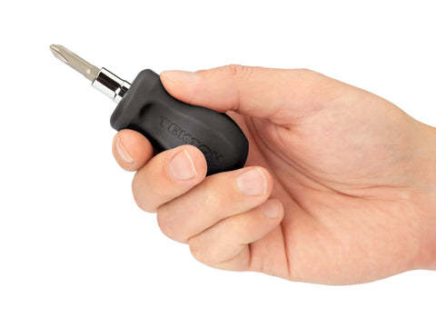 Hand holding 3-In-1 Stubby Multi-Bit Driver With Phillips And Slotted Bits, 1 Quarter Inch Shank 1 Nut Driver Bit Tube.