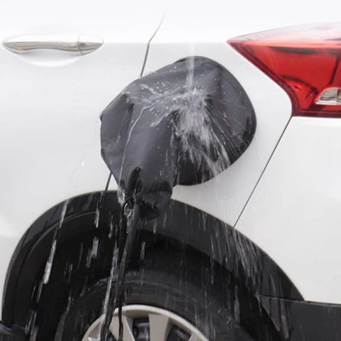 Magnetic EV Port Protector Hella Waterproof Plug Cover with Strong Grip Magnet blocking rain on electric vehicle charging port.
