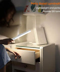 Person using Wireless Led Under Cabinet Lighting With Motion Sensor Battery Powered Closet Light 21 Led Bulbs Magnetic Stick On Night Light Bar