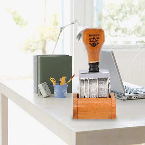 Top Shelf Adjustable Roller Date Stamp on a desk, showcasing wood grip and metal roller for easy date marking, ideal for office tasks.