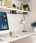 Under Desk Laptop Mount With Adhesive And Screws Aluminum Shelf Holder installed under a desk with accessories in an office setting