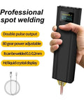 Handheld Portable Spot Welder With Adjustable Gear And Power For DIY Projects Compact Welding Machine For Precise Spot Welds 80 Gear Precision Lightweight Spot Welding Equipment shown held in hand showcasing LCD display and dual pulse output.