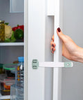 Five Pack Green ABS Baby Safe Cabinet Locks With 360 Degree Rotation And Double Press Buckles Durable Childproof Drawer And Refrigerator Latches For Quick Safe Cabinet Security shown on fridge handle