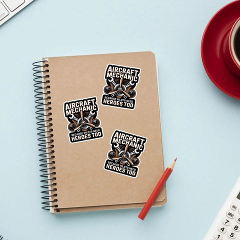 Plane Techs And Pilots Sticker Pack: We Fix What Your Pilot Breaks Funny Aviation Maintenance Decals on notebook with pencil