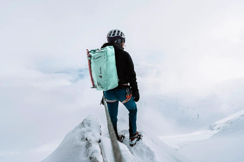 Mountaineer with Durascent 44 Plus 10L Alpine Backpack For Hiking And Mountaineering in snowy terrain, Wave Ink Color