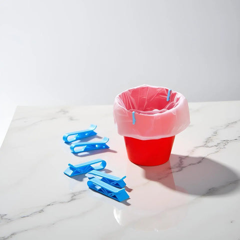 Lock Tight Plastic Garbage Bin Clips With Textured Anti Slip Grip Kick The Slipping Habit And Keep Kitchens Fresh Secure Trash Bag Holders 10 Pack on red container with pink liner.