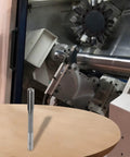 14mm HSS chucking reamer with 6 flutes and H7 straight shank on table, milling machine background