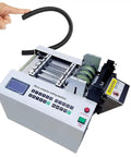 Heavy Duty Automatic Heat Shrink Tube Cutter With 300 Watt Digital Motor And Cable Wire Stripper Function For Fast Rubber Plastic Tubing Slicing Up To Fifty Millimeters Cool Working Machine with black tubing ready for slicing.