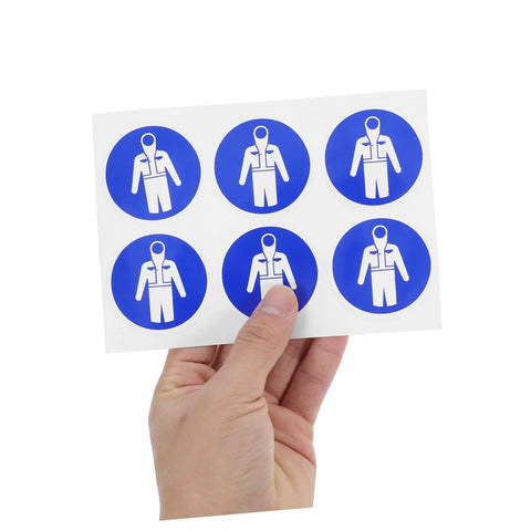 Sheet of circular blue Ten Pack Protection Suit Warning Labels and Adhesive Safety Stickers for Factory Equipment held by a hand.