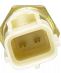Close-up of engine coolant temperature sensor with two-pin connector, white housing and amber body.