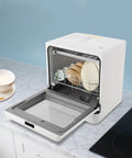 1.8 Gallon Countertop Dishwasher In White With Four Wash Modes And 360 Degree Spray Arms For Thorough Cleaning Plus High Temp Water And Hot Air Drying, open with dishes and bowls inside.