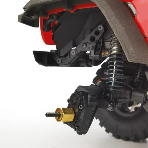 Close-up of a 1/10 RC car with Four Brass 13mm Extended Wheel Hubs With Steel Stub Axles For 1 Tenth RC Crawler Upgrades