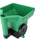 Handheld 3L Manual Lawn Spreader For Fertilizer And Salt with green PP body, black handle, used for lawn and garden maintenance.