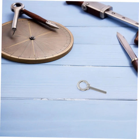 Built Like A Tank Stainless Steel Eye Bolts M10x60 Heavy Duty Hardware Kit With Locking Nuts And Washers on blue wood background.