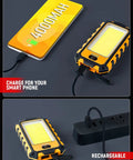 Rechargeable Magnetic LED Work Light 40W 1500 Lumens with charging feature, orange color, shown charging smartphone and plugged in.